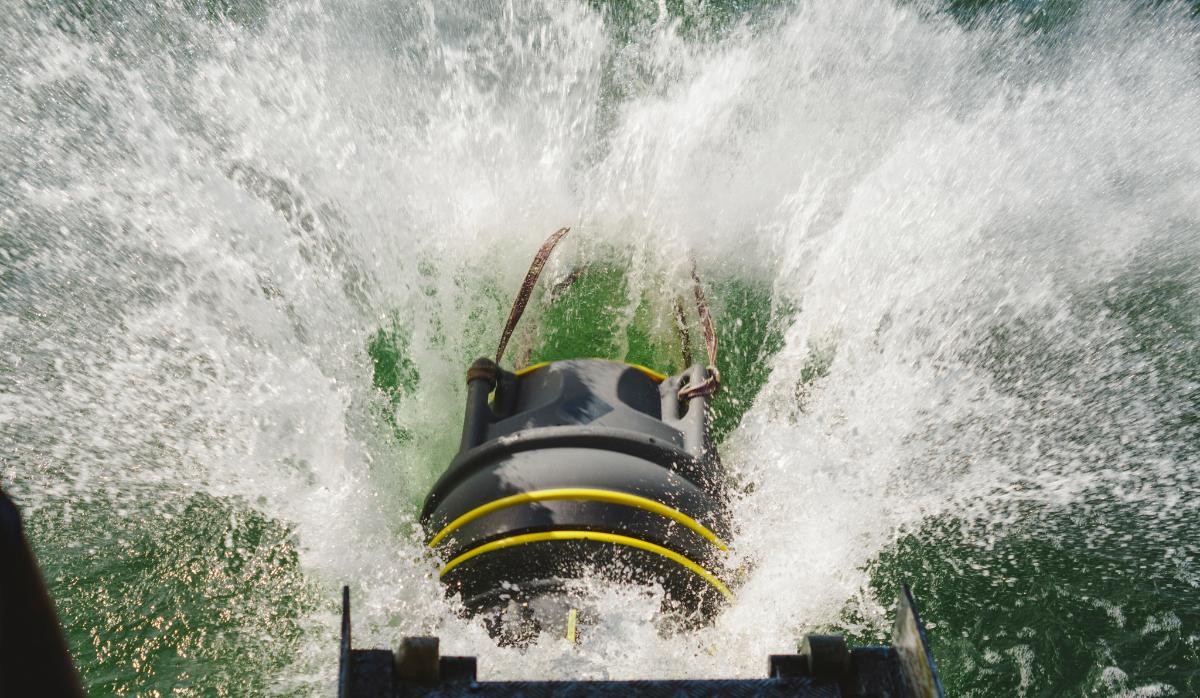 A Blocker naval mine is dropped into the sea from a navy ship.