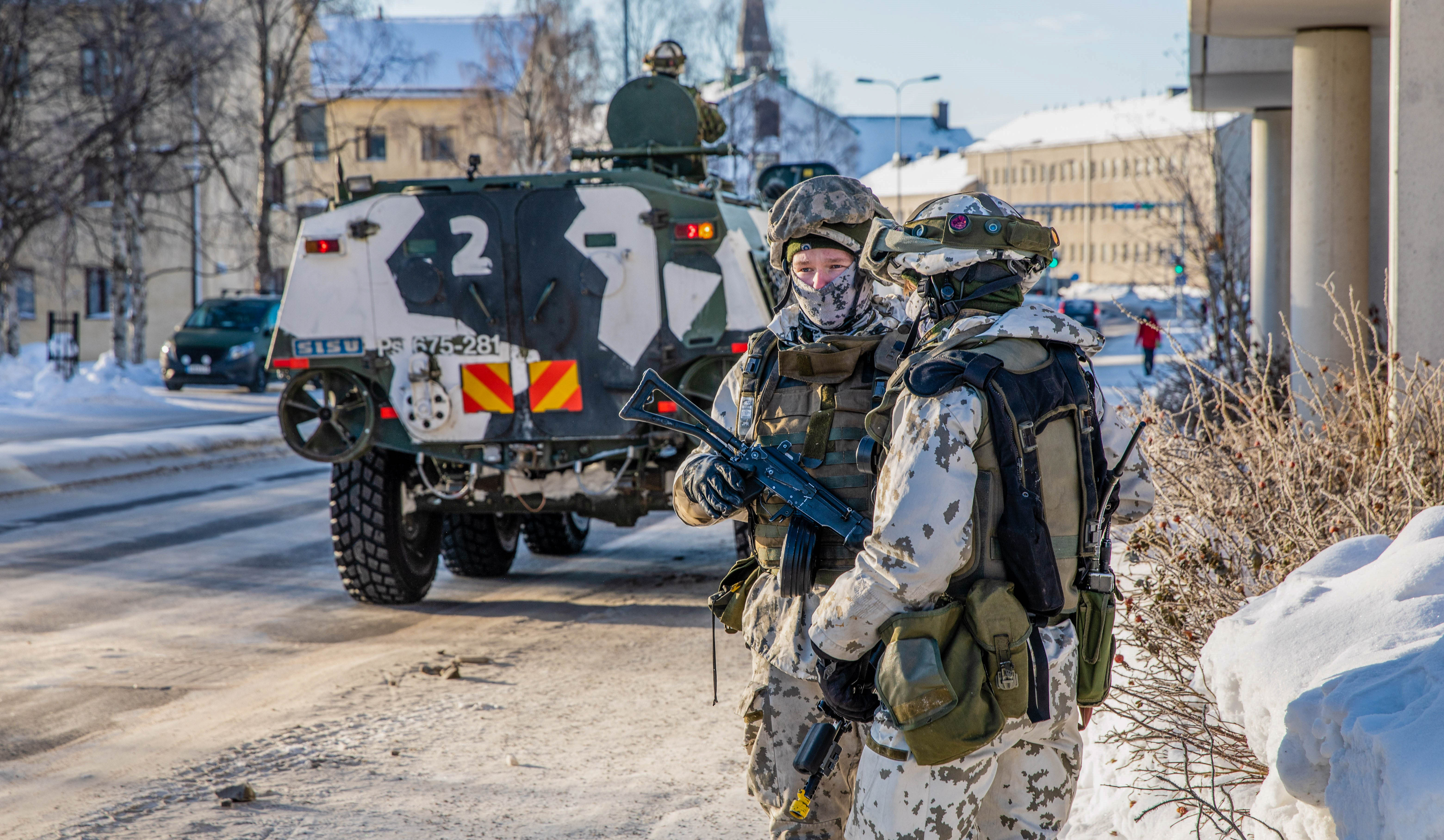 Soldiers and an armored vehicle in the streets