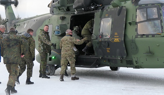 OSCE observers boarding a helicopter for aerial observation.