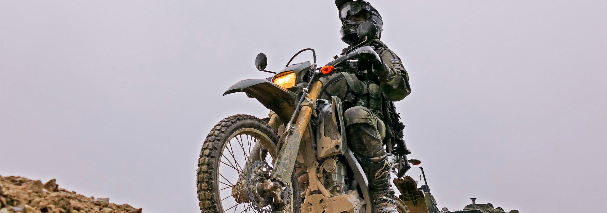 Conscript driving a motorcycle.