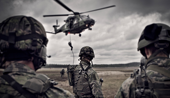 Fighters drop off a helicopter using a rope