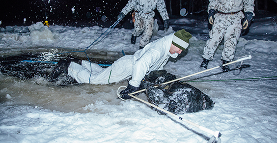 The soldier lifts himself out of the cold opening