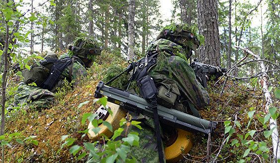 Soldiers aim from behind the rot