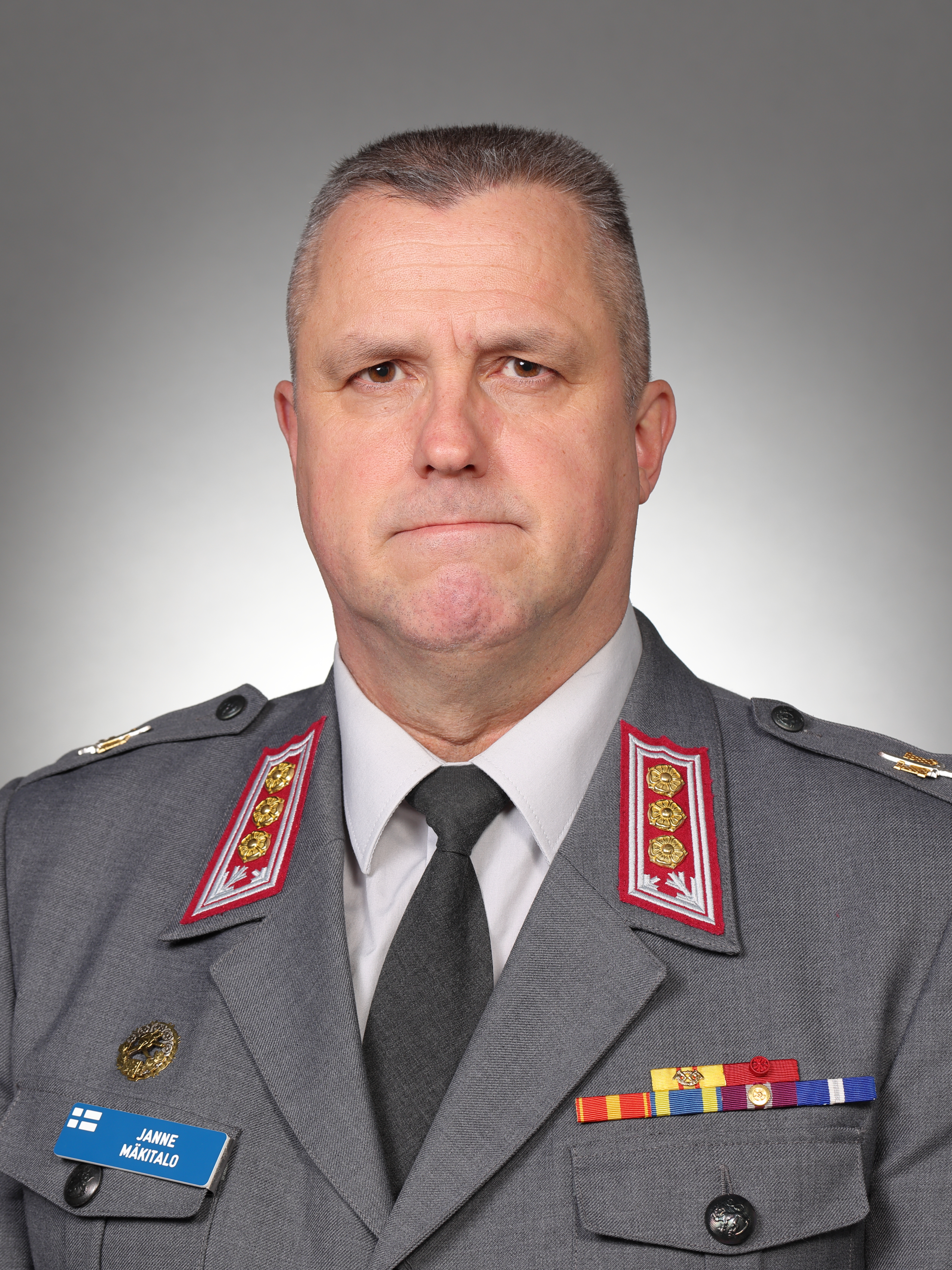 Maasotakoulun johtajan potrettikuva.