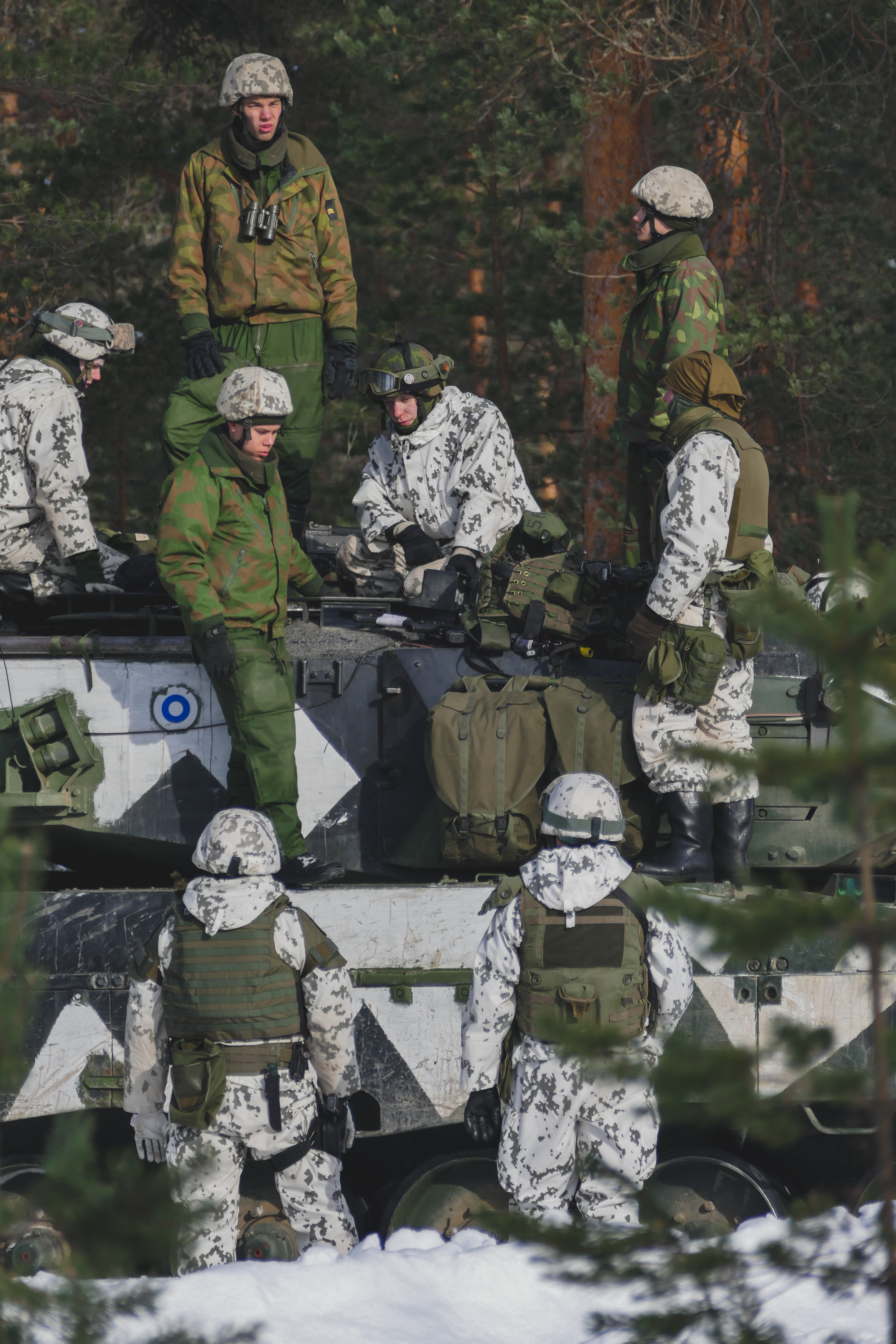 Soldiers on the roof of a tank