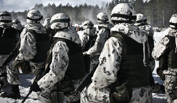 Soldiers in high knee position wearing white camo clothes and armor