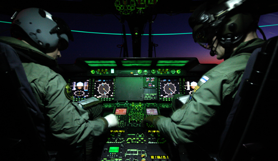 Pilots in the cockpit of a NH90 helicopter in night time
