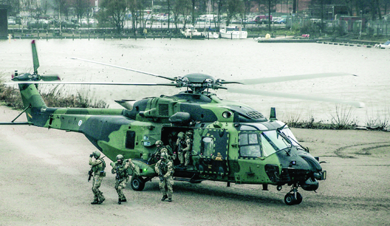 Soldiers coming out of a helicopter