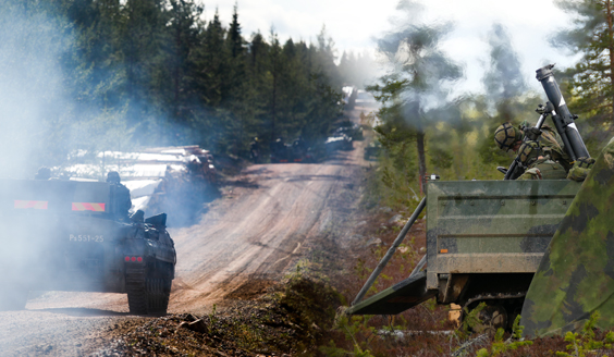 A grenade launcher is firing, a tanker is driven next to it