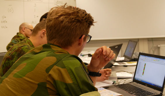 Soldiers using computers in a classroom