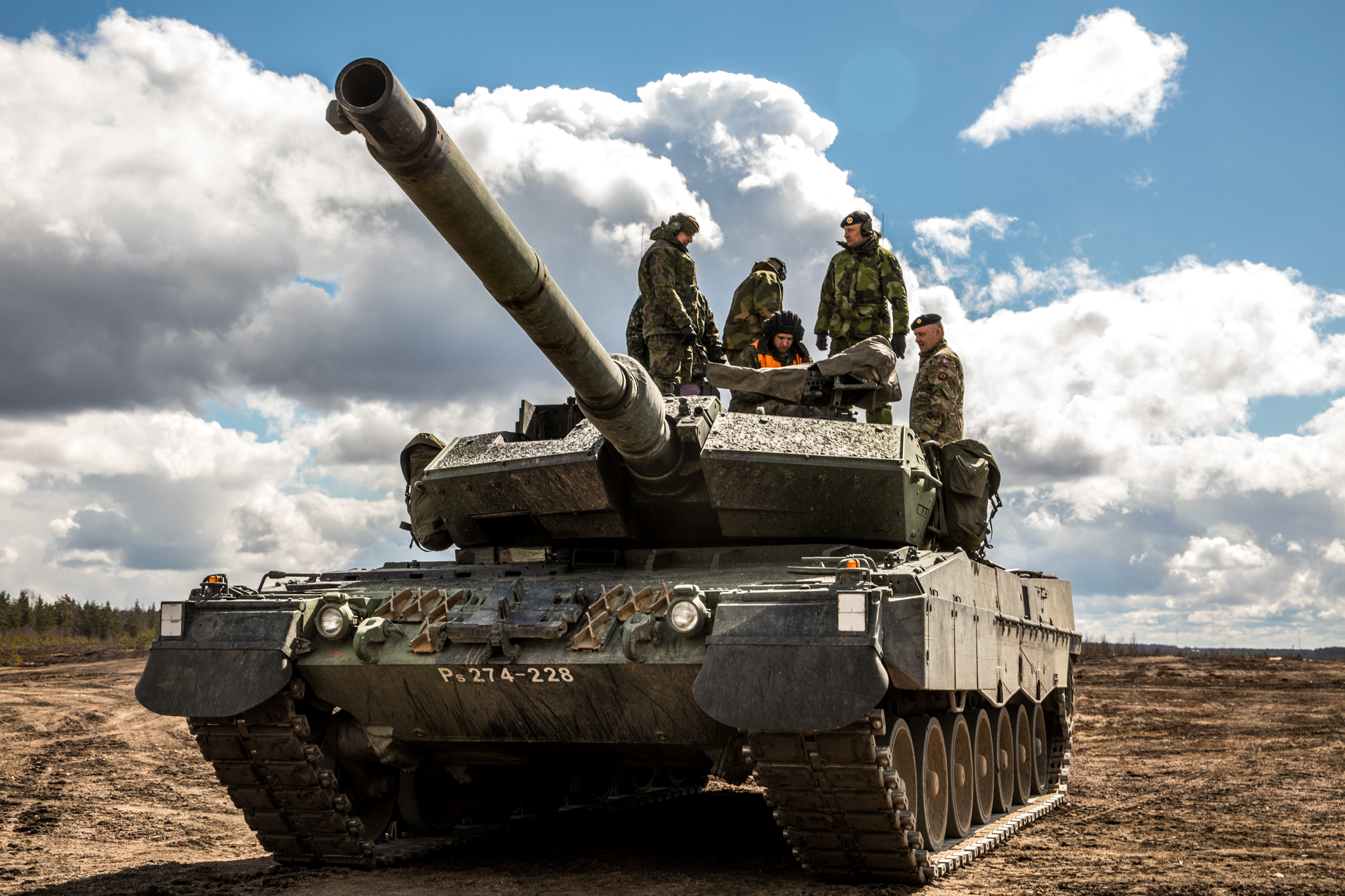 Soldiers standing on a tank