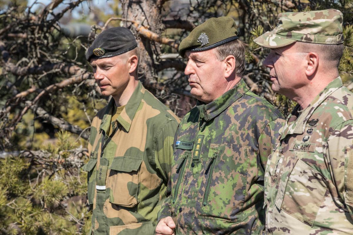 Three highly ranked officers observing