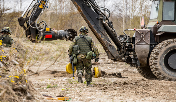 Soldier carrying mines