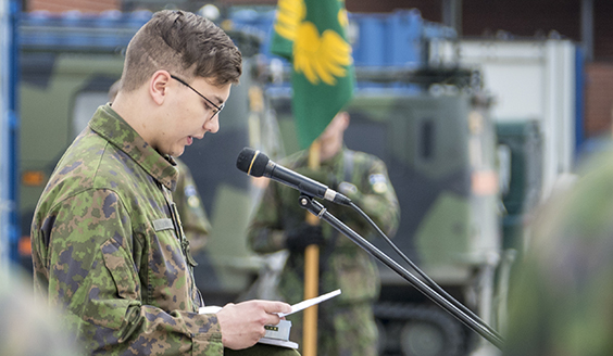 Soldier talking to a microphone
