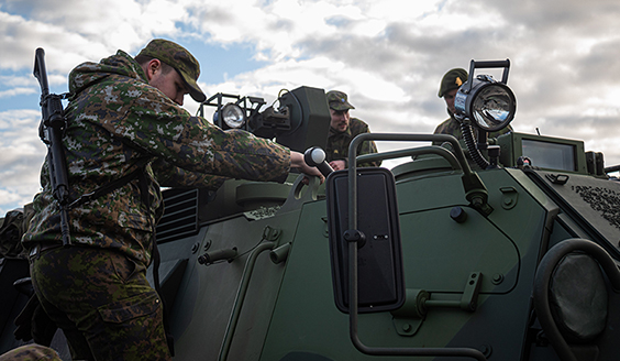 Reservists studying armoured personnel carrier Sisu XA-185.