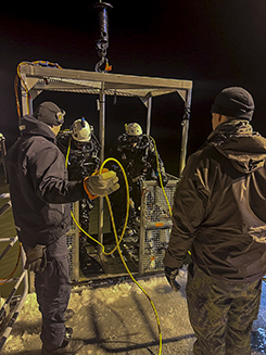 In the picture, Navy divers testing their equipment.